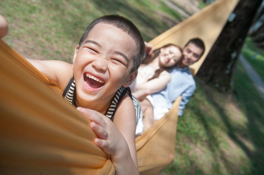 Family lounging on hammock